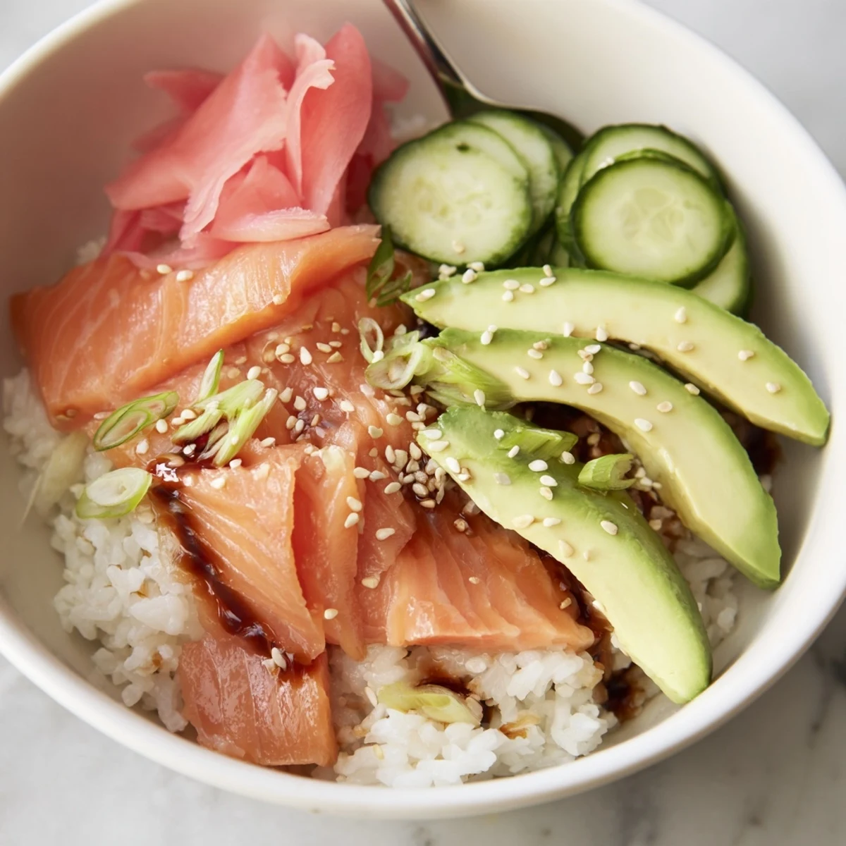 Flavorful Leftover Salmon & Rice Bowl showcasing colorful toppings and steamed ingredients  