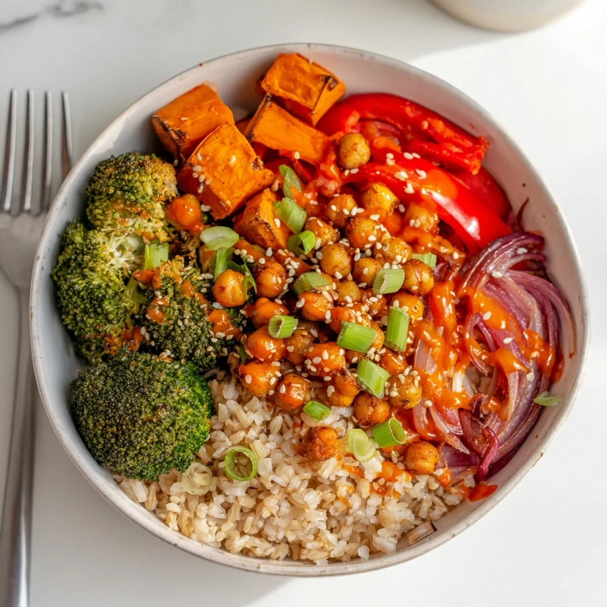 Vibrant Bold Sauce Drizzle Bowls topped with roasted veggies and luscious sauces.  