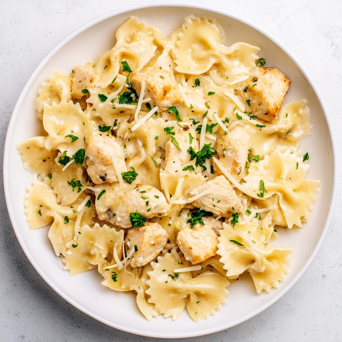 Golden, bite-sized chicken pieces in the Mozzarella Garlic Butter Chicken Bowties with melted cheese and herbs.