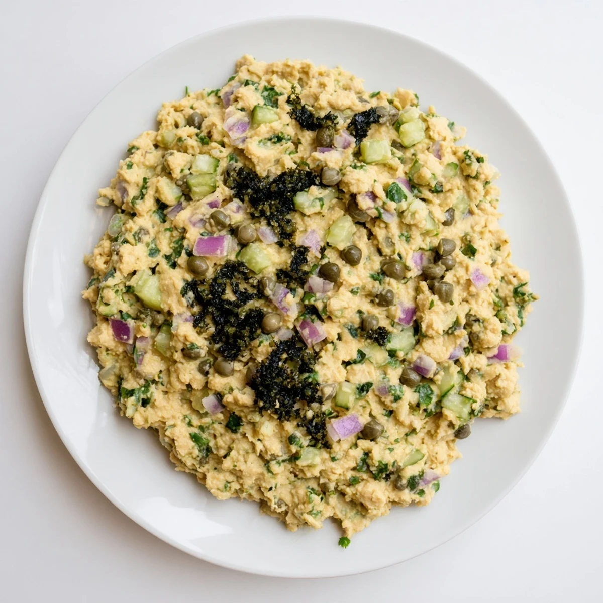 Creamy chickpea tuna salad, a vegan delight with savory flavors and fresh herbs, ready to serve.