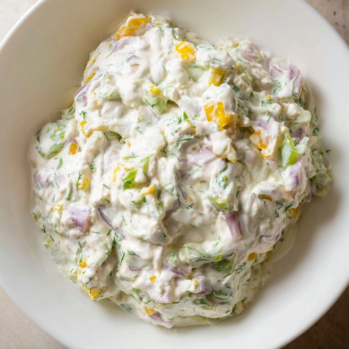 Enjoy a spoonful of chilled sweet and sour pickle relish dip, ready to top a juicy burger.