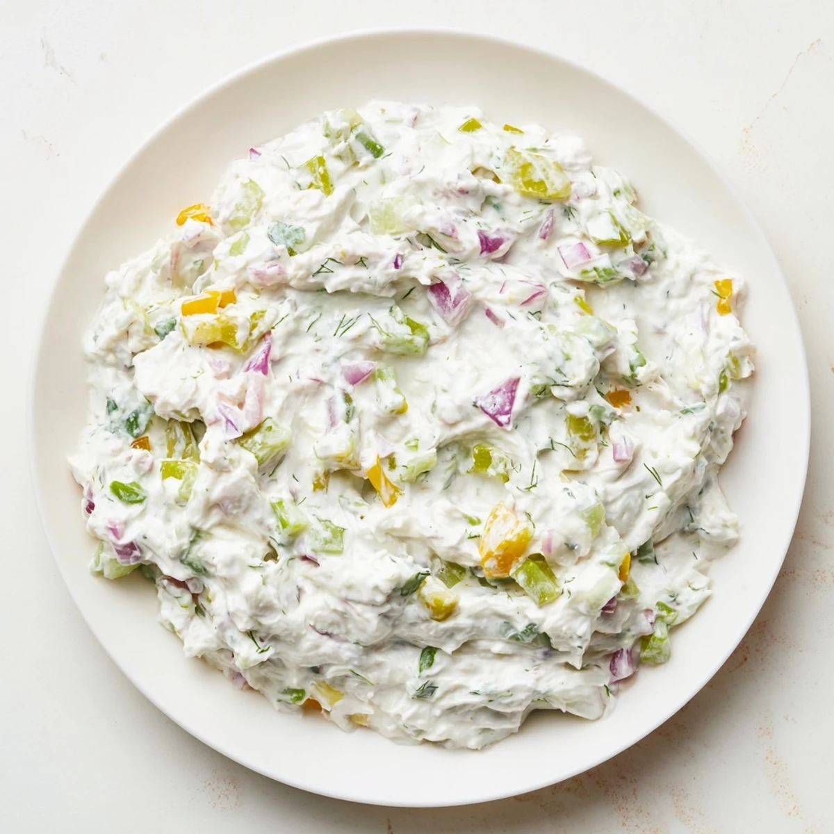 A close-up of sweet and sour pickle relish dip, showcasing the texture and vibrant colors of the relish.