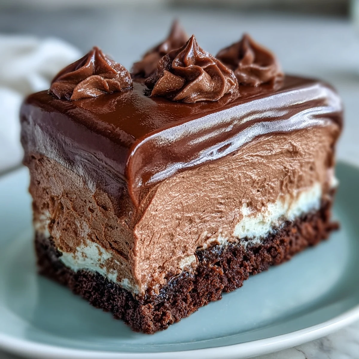 Luxurious chocolate mousse filling for cakes, glossy and creamy, made with premium chocolate for a velvety texture and deep flavor.