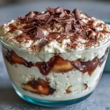 Whipped Cottage Cheese Tiramisu Bowl, a light dessert dusted with cocoa powder.