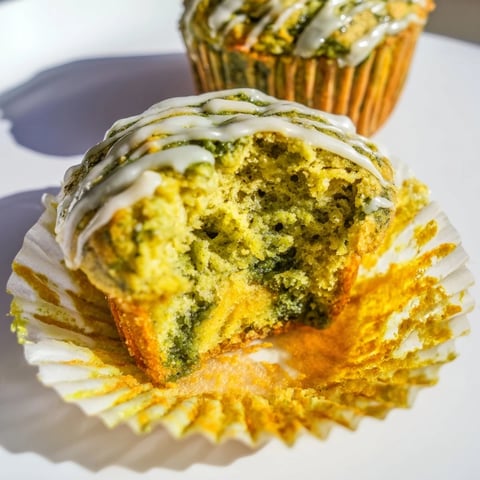 Tender Matcha Pumpkin Scone Muffins drizzled with vanilla glaze for a delightful treat.  