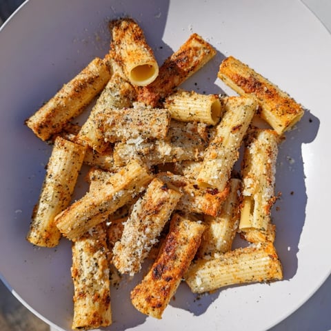 Crispy pasta chips seasoned variety served warm with vibrant dips and spices.  