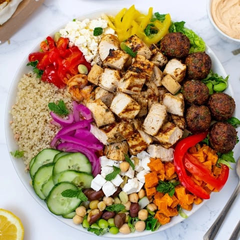 A beautiful spread of Build-Your-Own Boards & Bowls showcasing vibrant fresh ingredients.  