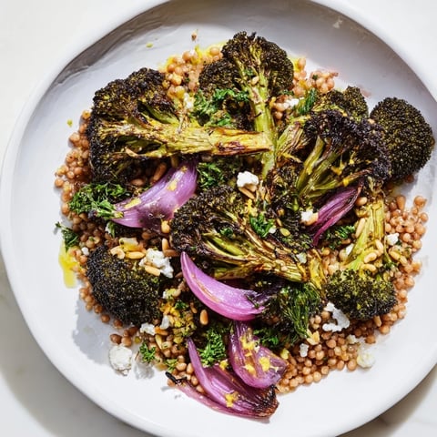 Warm Roasted Broccoli with Garlic-Lemon & Farro Base, featuring vibrant roasted broccoli on a bed of fluffy farro.