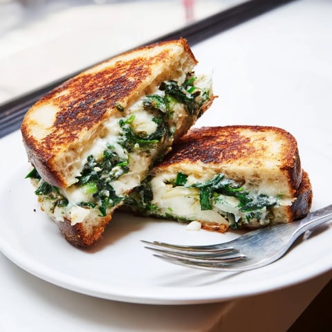 Air Fryer Spinach & Artichoke Dip Grilled Cheese: a melty, golden sandwich, perfect for a comfort food craving.