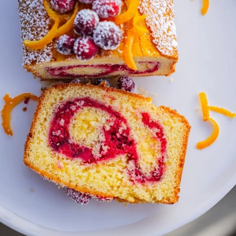 Vibrant Cranberry Orange Swirl cake, swirled with a beautiful pattern, ready to enjoy this winter.
