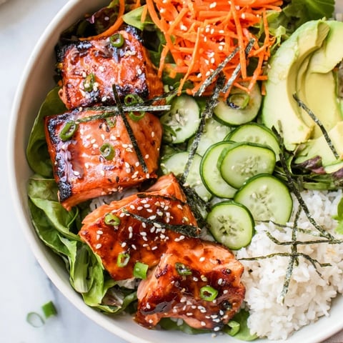 Fresh, vibrant Poke Bowl Salad featuring glistening salmon, avocado, and a soy-ginger dressing, ready to eat.
