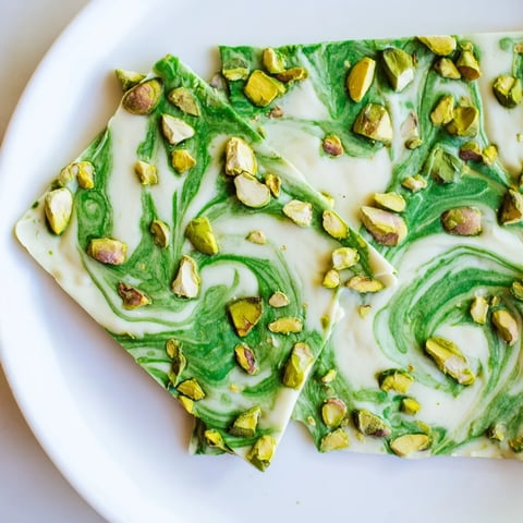 Close-up view of Pistachio Matcha White Chocolate, a beautiful dessert with vibrant green matcha swirls.