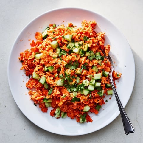 Crushed Flamin Hot Cheetos tossed with crisp cucumber, fresh cilantro, and a zesty lime-hot sauce dressing.