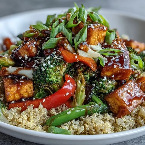 Fluffy quinoa base topped with stir-fried vegetables and crispy tofu in a savory teriyaki glaze.