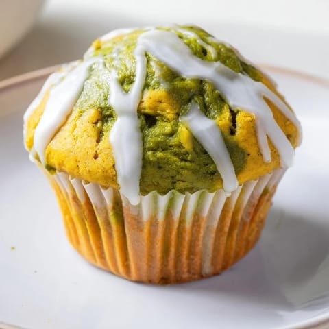 Moist and flavorful Matcha Pumpkin Scone Muffins served warm, perfect for breakfast bliss.  