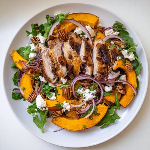 Tender chicken and colorful squash make this easy Roasted Chicken Sheet-Pan Salad a perfect meal.