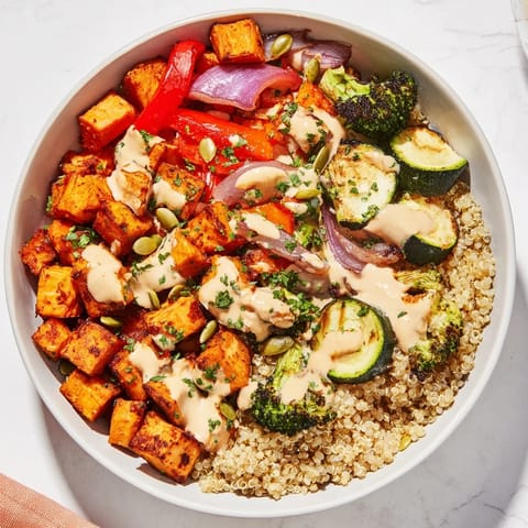 Vibrant quinoa bowl brimming with colorful roasted seasonal vegetables, ready for a healthy, delicious meal.
