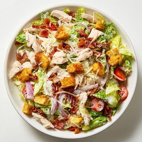 Fresh, flavorful salad: A colorful Costco Chicken Bake Salad Bowl featuring romaine and mozzarella.