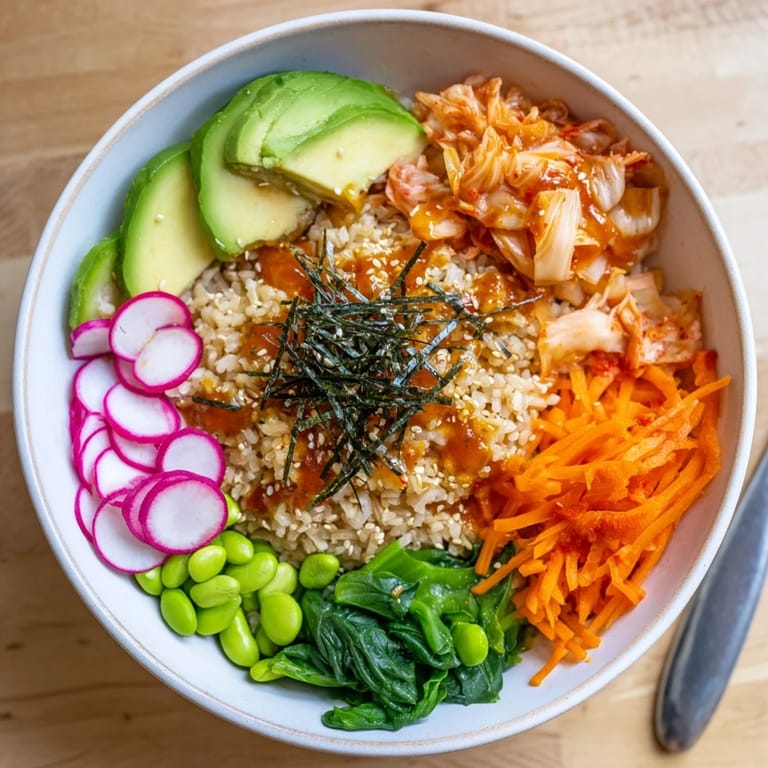 Healthy Fermented Vegetable Bowl featuring hearty grains, kimchi, and an aromatic dressing drizzle.