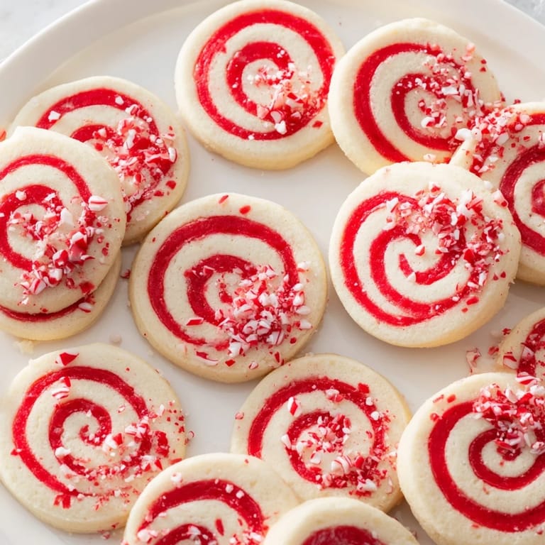 Homemade Candy Cane Swirl Cookies; a close-up image of the baked cookies, ready to be enjoyed.