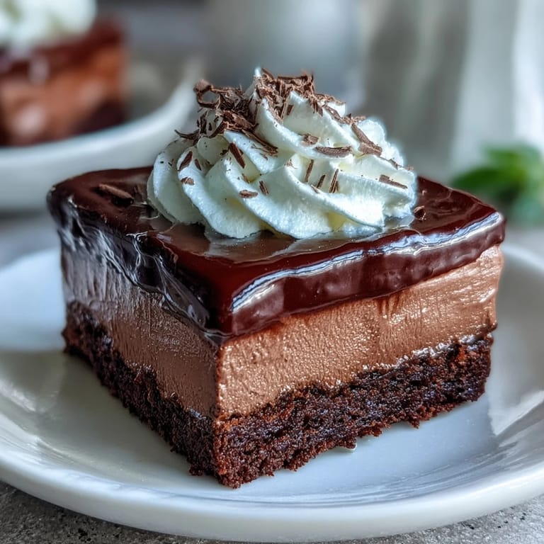 Silky chocolate mousse filling for cakes, whipped to fluffy perfection, ideal for elegant dessert presentations and indulgent bites.