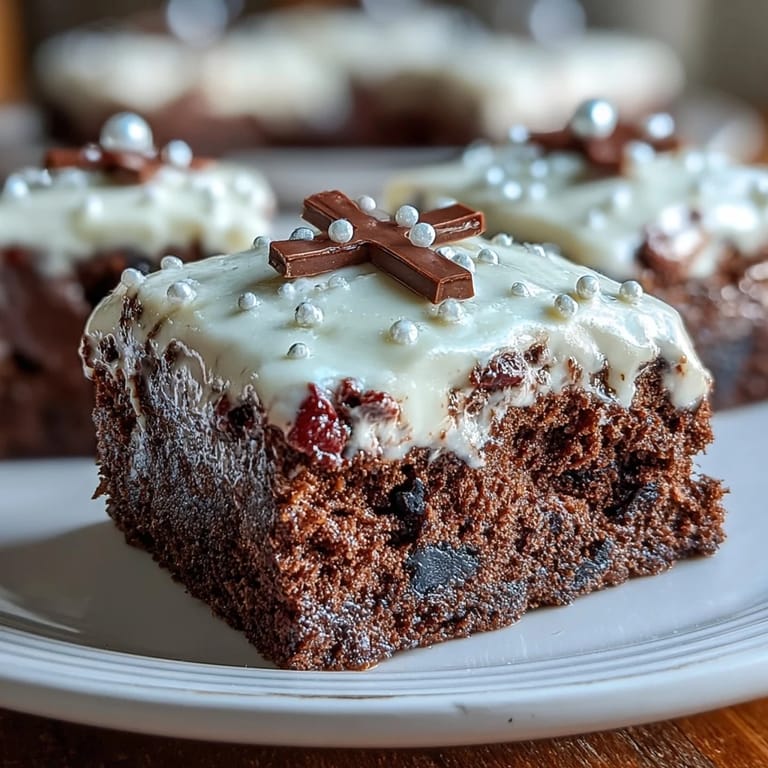 Delicate vanilla sponge layered with silky buttercream, adorned with white fondant roses and a meaningful cross decoration.